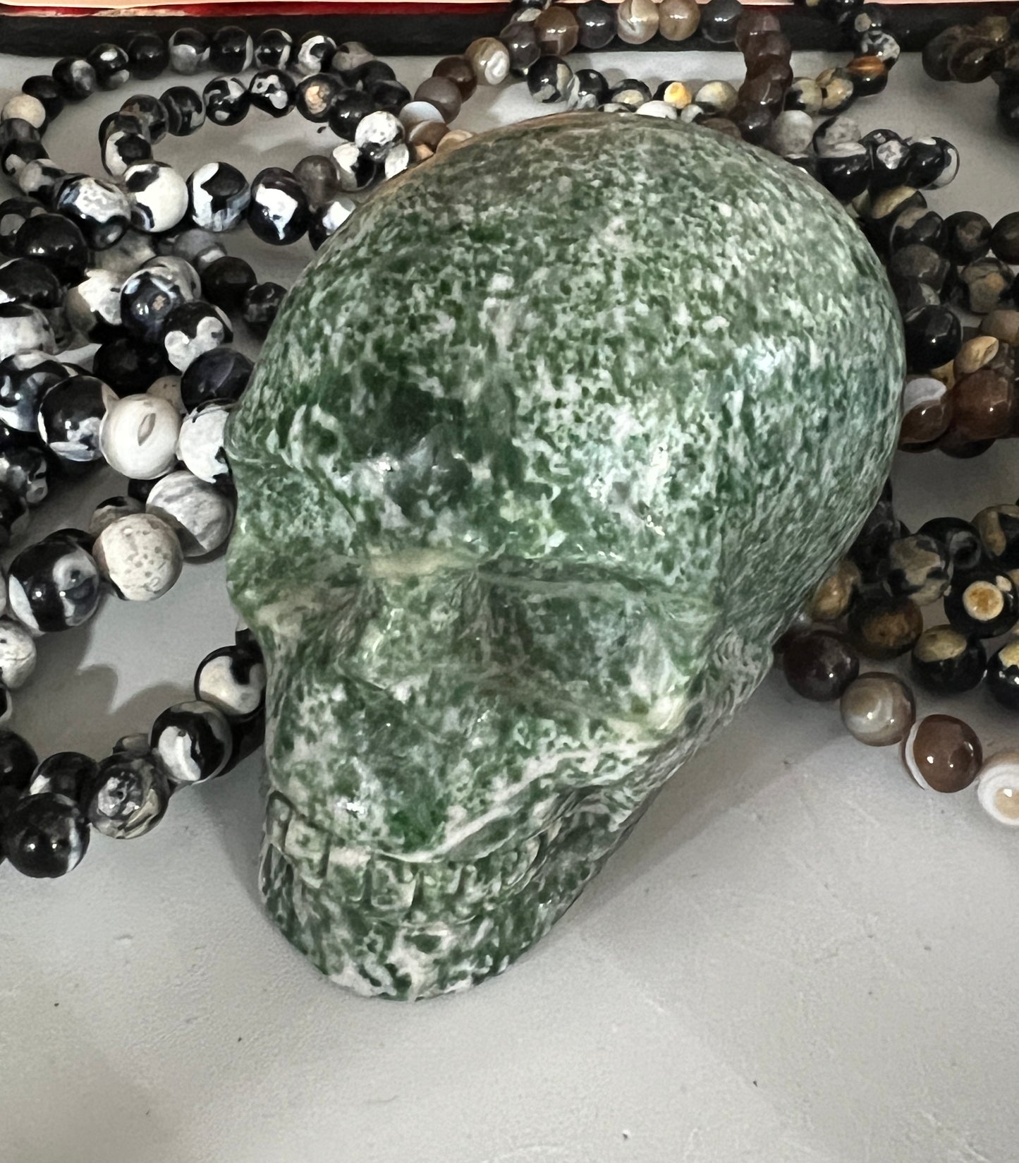 Green Dot Jade Skull Carving - Crystal Vibrations & Healing